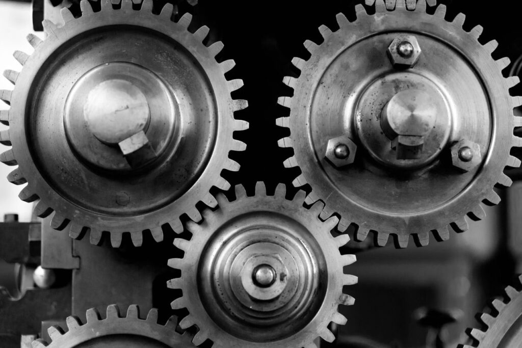 pexels photo 149387 149387 Detailed black and white image of interlocking metal gears showcasing industrial mechanics.