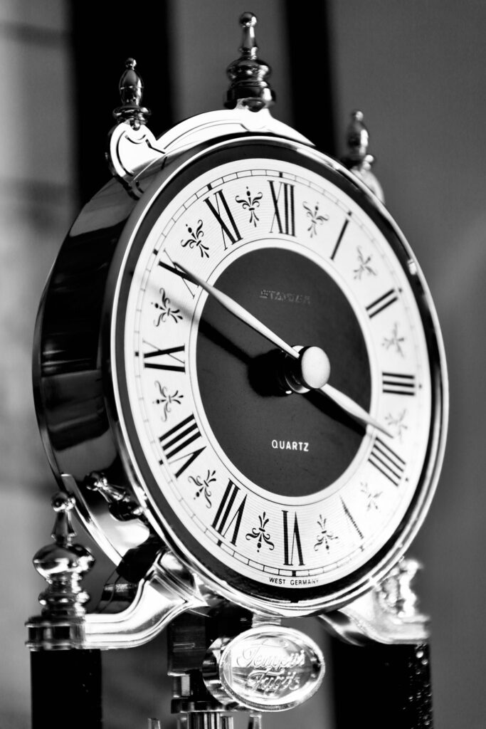 pexels photo 30133608 30133608 Close-up of a vintage style quartz clock with Roman numerals, capturing the essence of time.